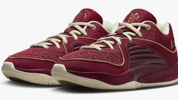 Side view of Kevin Durant's red and gold basketball shoes.